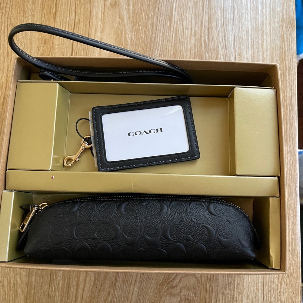 Kit Coach. Leather